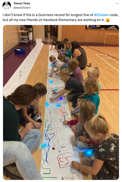 An image of students create the longest line of color coding with Ozobots