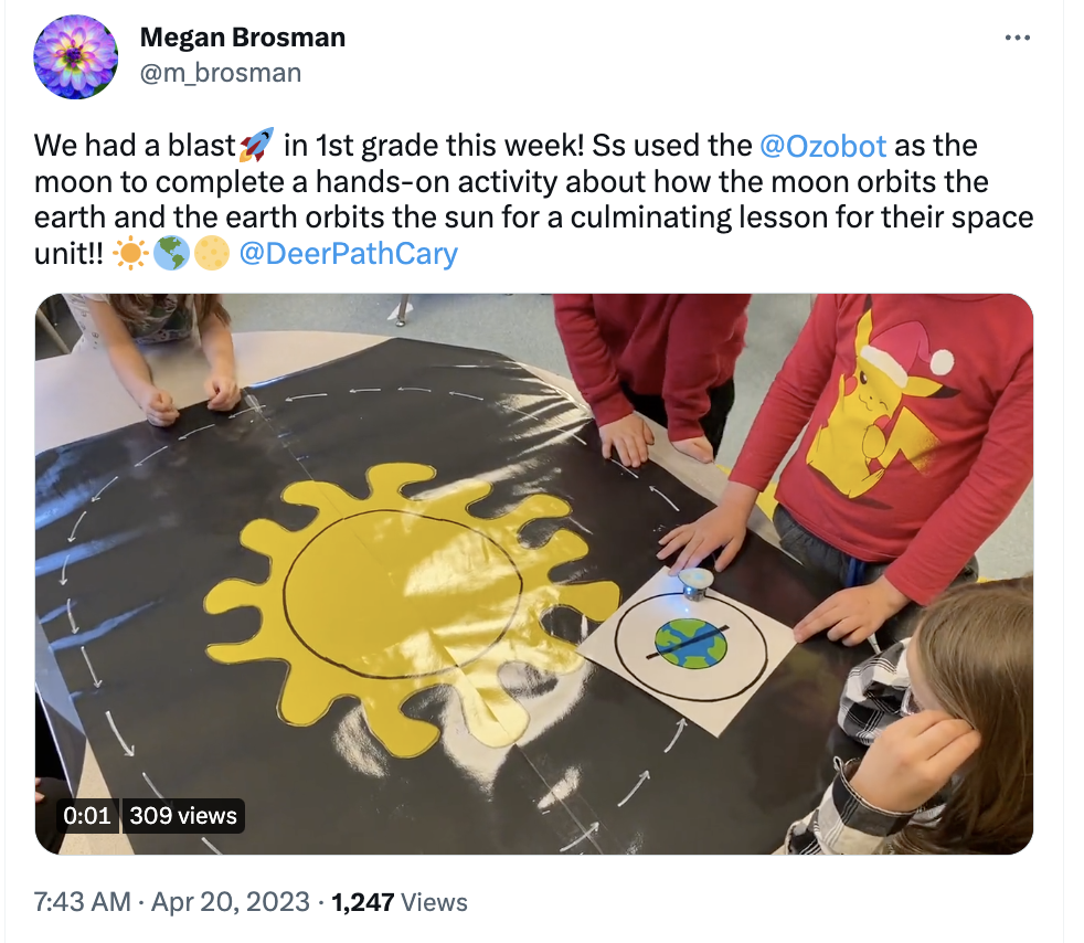 A picture showing students completing a hands-on activity about how the moon orbits the earth and the earth orbits the sun